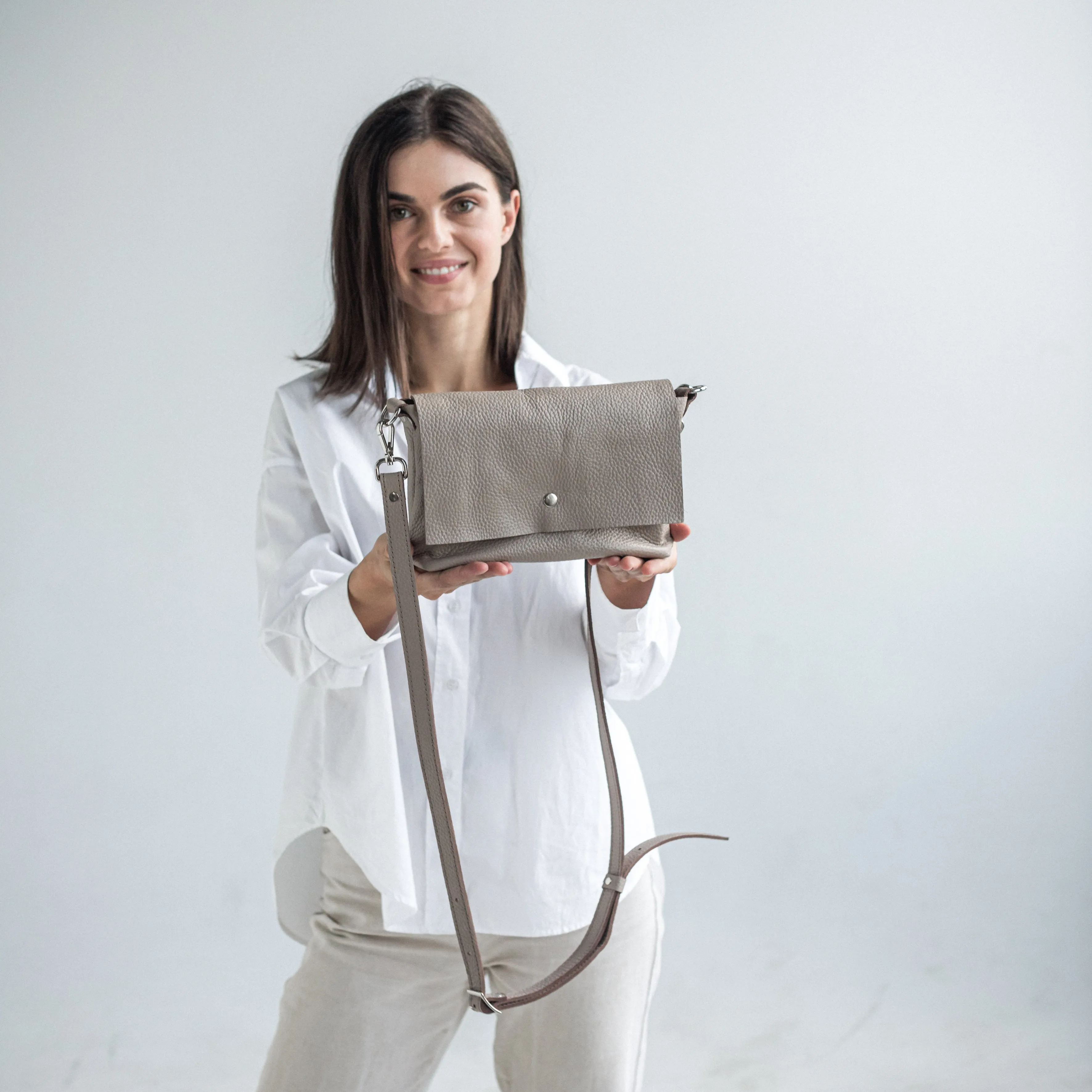 Beige pebbled leather crossbody bag