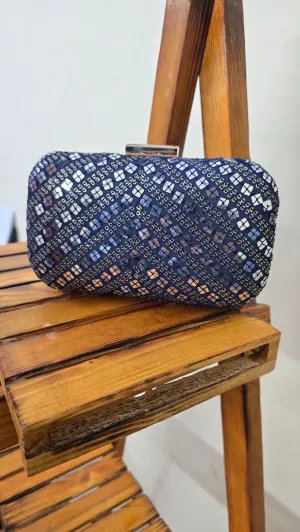 Navy blue fabric clutch bag