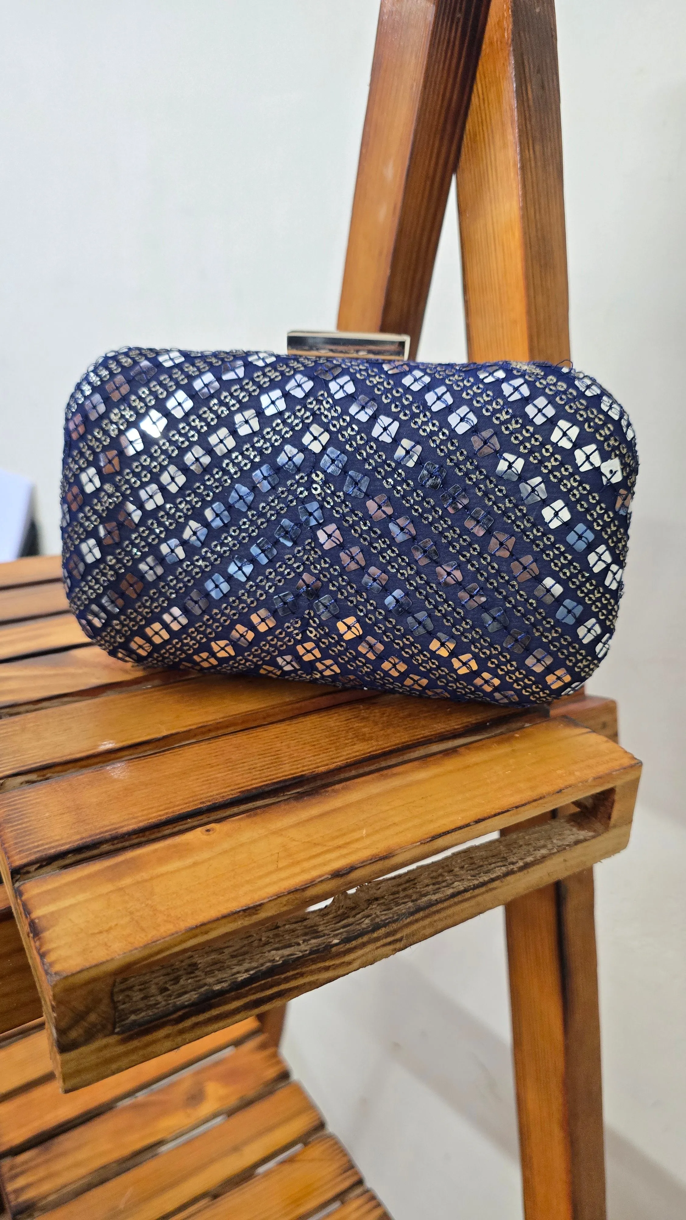 Navy blue fabric clutch bag